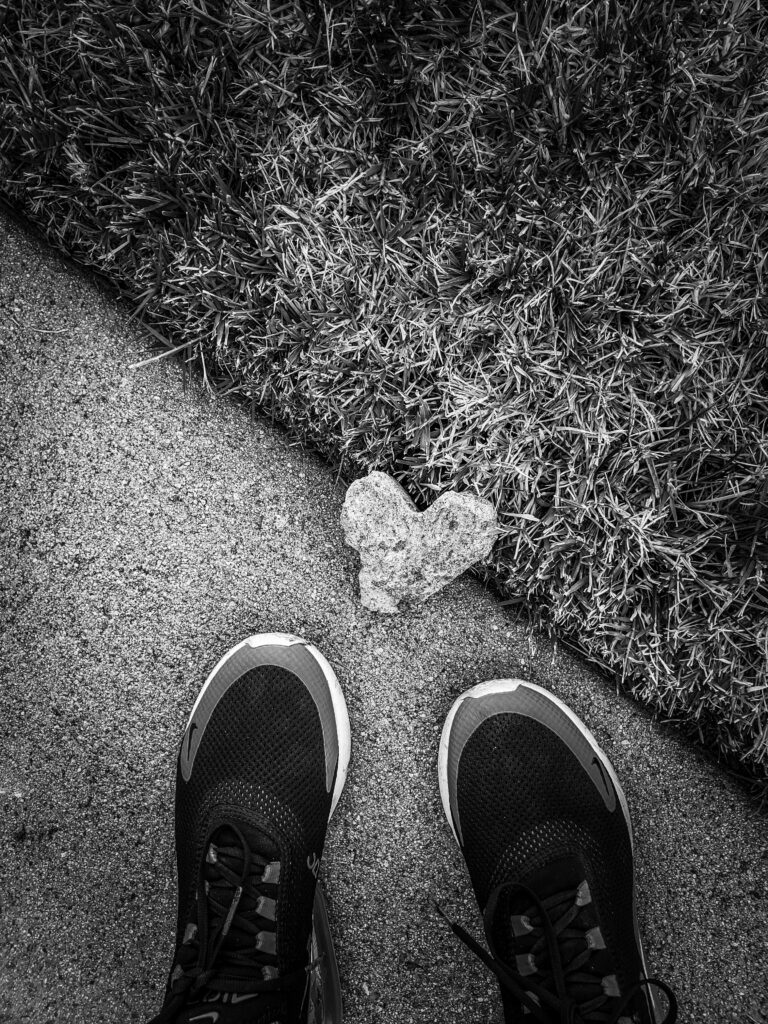 Heart shaped stone with a pair of shoe