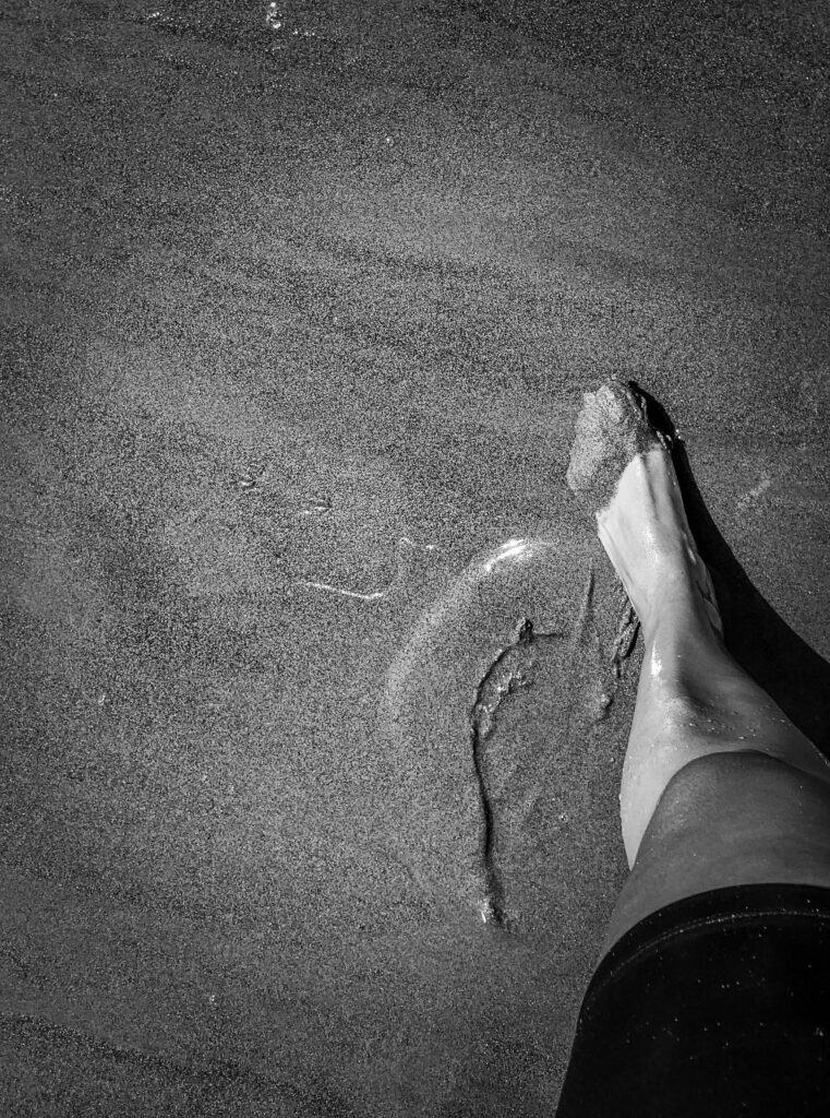 Photography of a person leg in beach